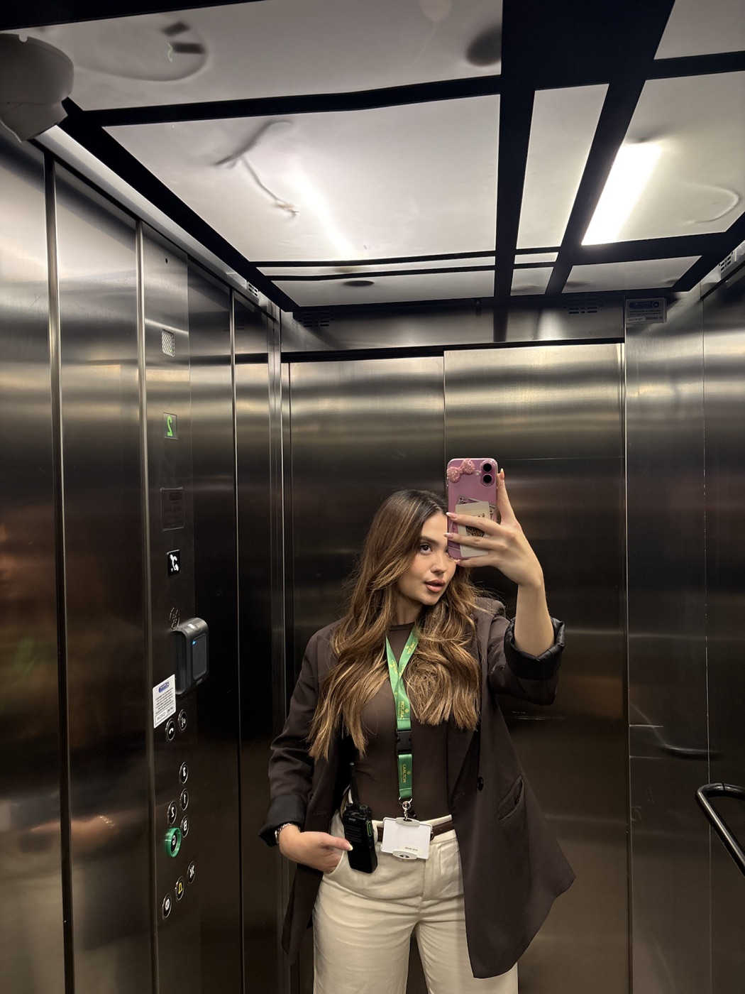 Lucía Franco Moreno taking a mirror photograph in a lift